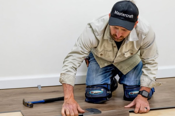 Mastercraft's flooring expert laying timber flooring
