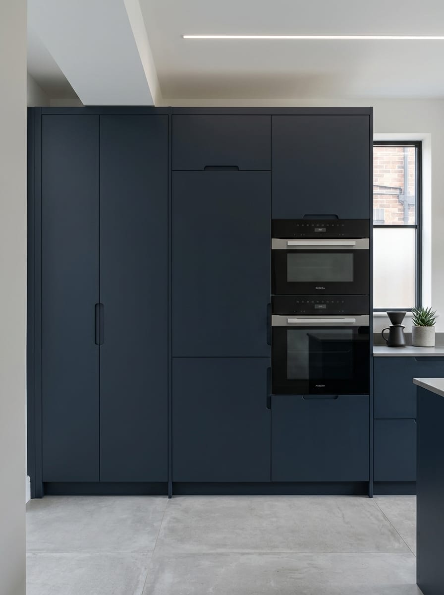 Bespoke kitchen installation, full-height cabinetry and considered storage design