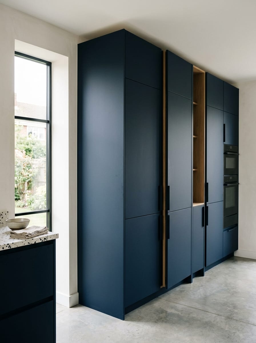Bespoke kitchen installation, full-height cabinetry and considered storage design