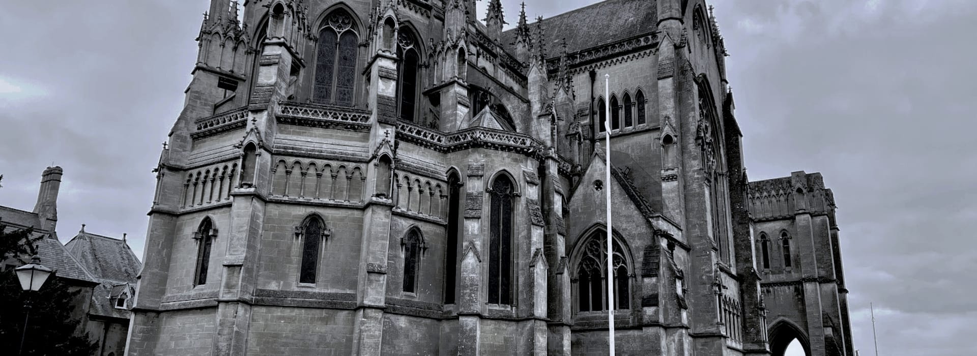 Gothic stone church with pointed arches and tall stained glass windows