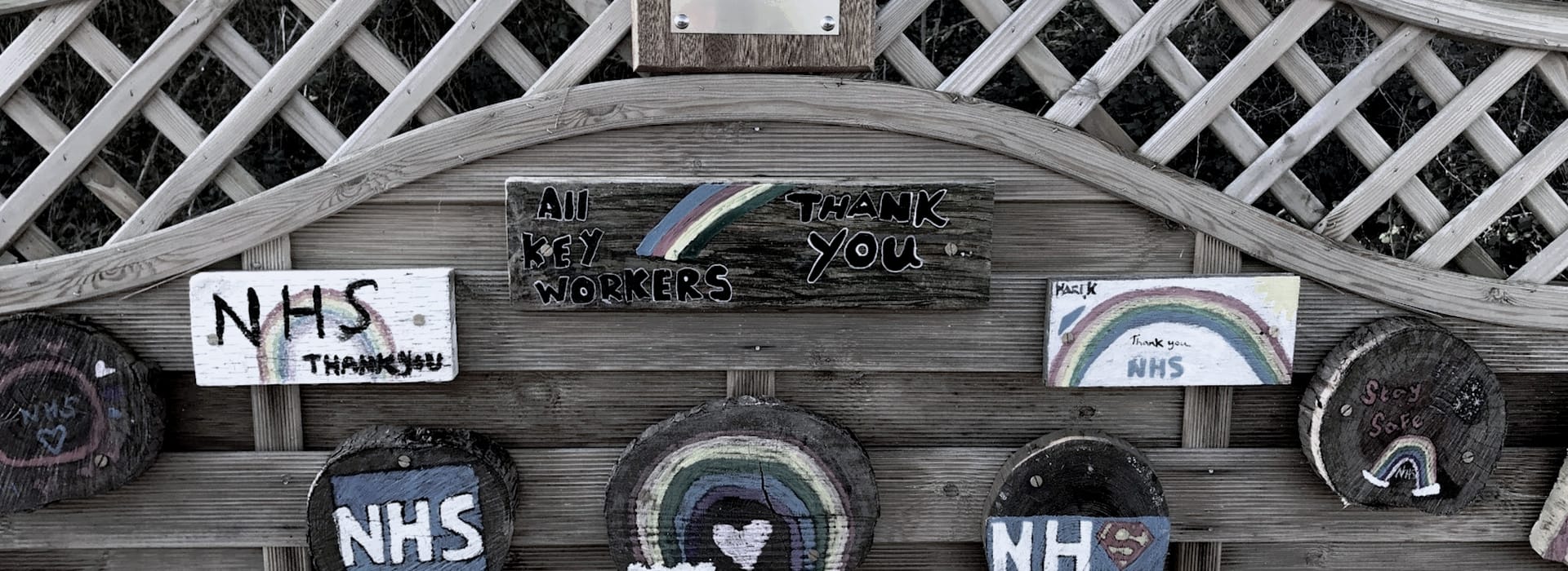 Bespoke Kitchens Brackla - Mastercraft Kitchens wooden fence with colourful hand-painted rainbow thank you signs