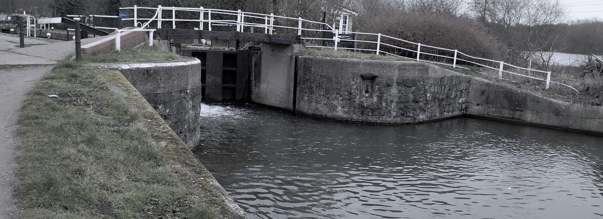 Bespoke Kitchens Cheshunt - Mastercraft Kitchens Stone canal lock with dark wooden gates and white railings
