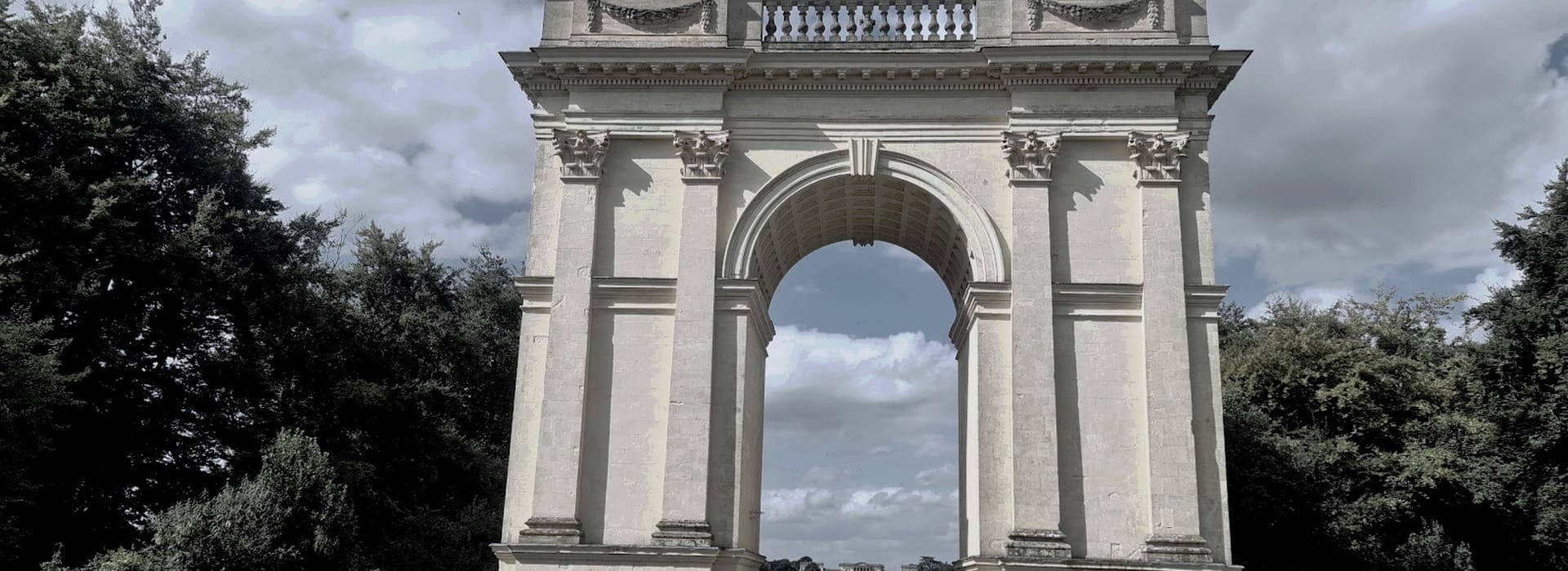 Bespoke Kitchens Buckingham - Mastercraft Kitchens large pale stone archway with ornate carvings and balustrade top