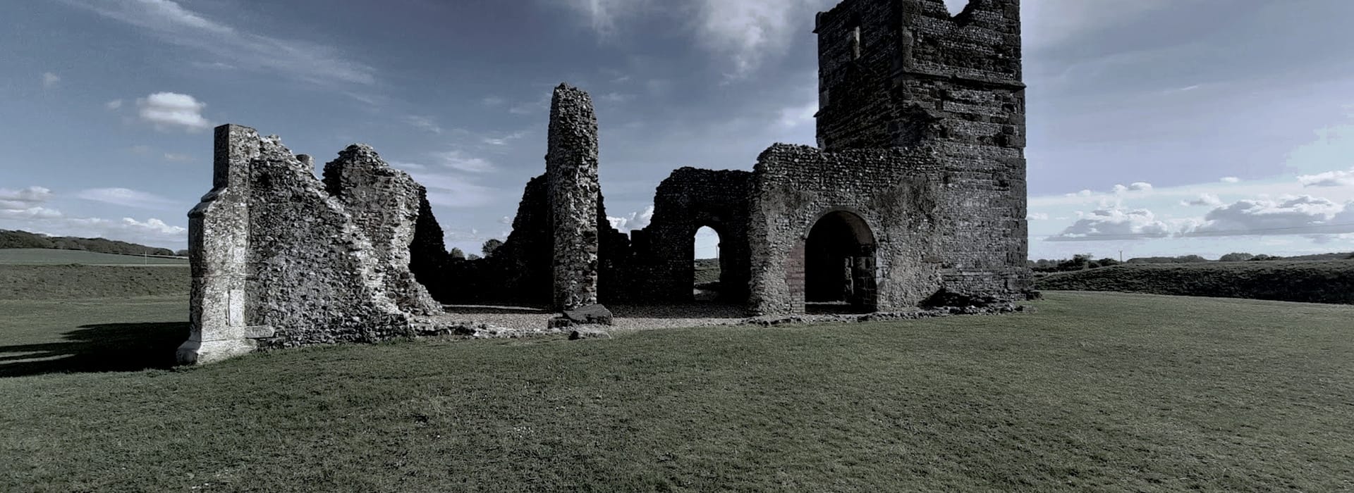 Bespoke Kitchens Wimborne - Mastercraft Kitchens ancient stone ruins with arched doorways on open grassy landscape