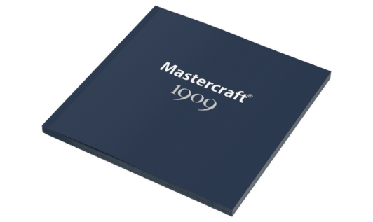 A dark blue Mastercraft 1909 brochure with silver text on the cover