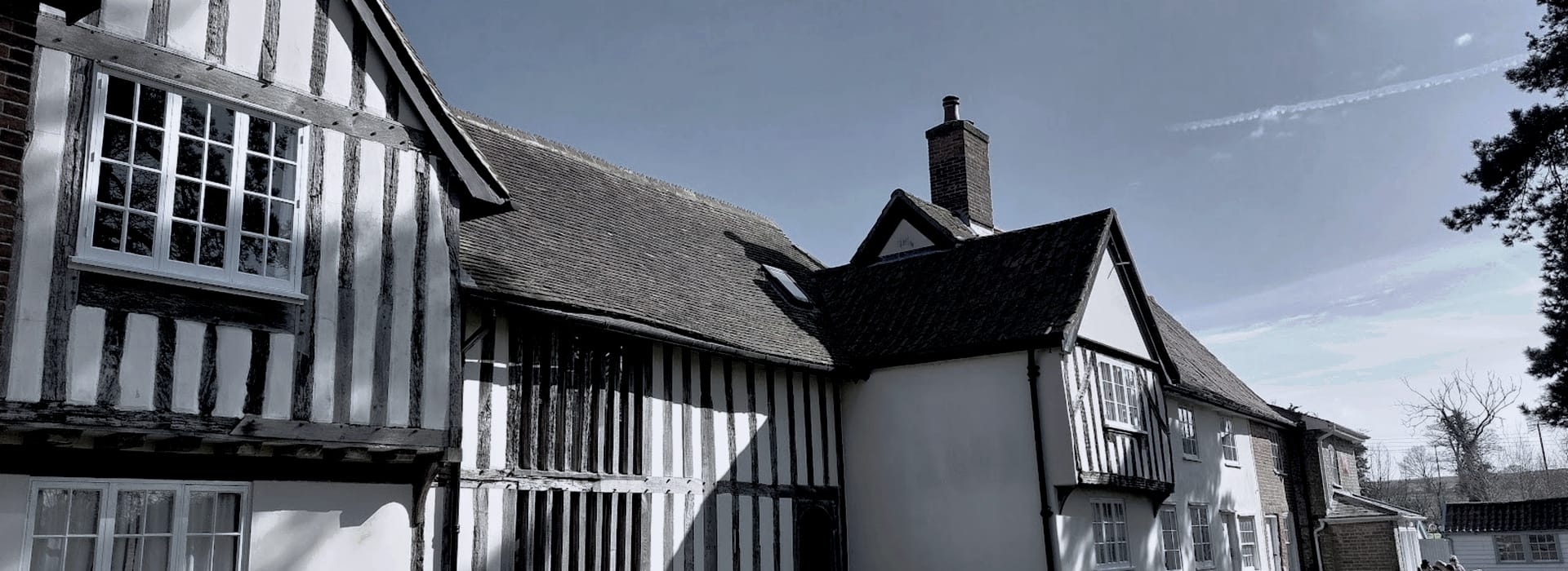 Tudor style house with exposed timber beams and steep pitched roof