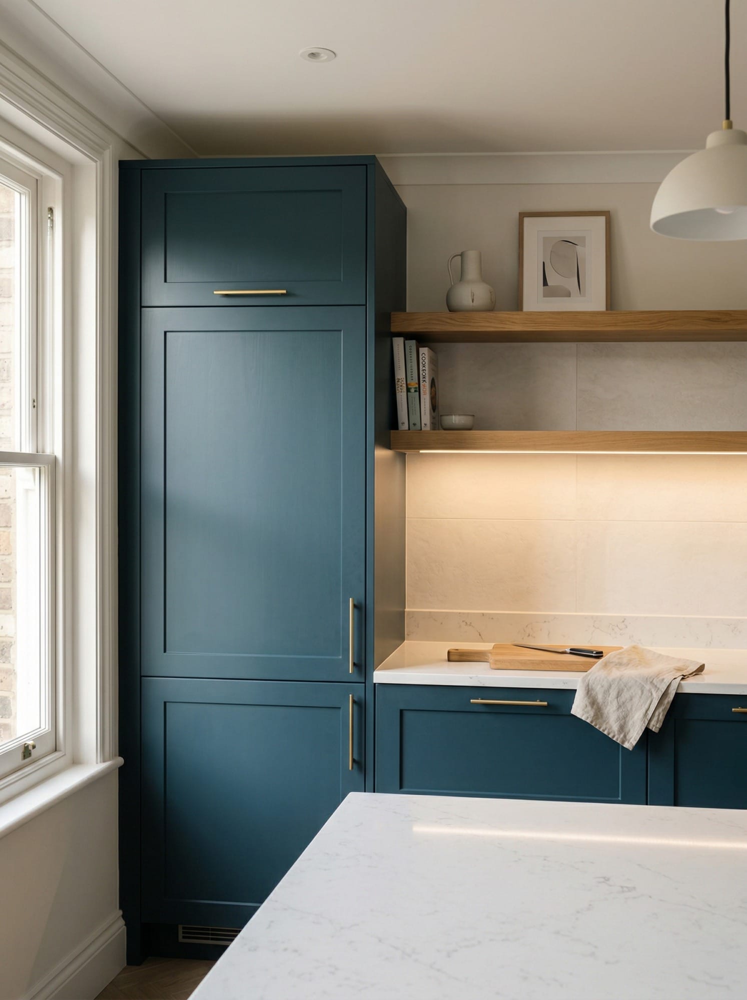 Full-height bespoke kitchen cabinetry by Mastercraft, matt painted handleless slab cabinetry