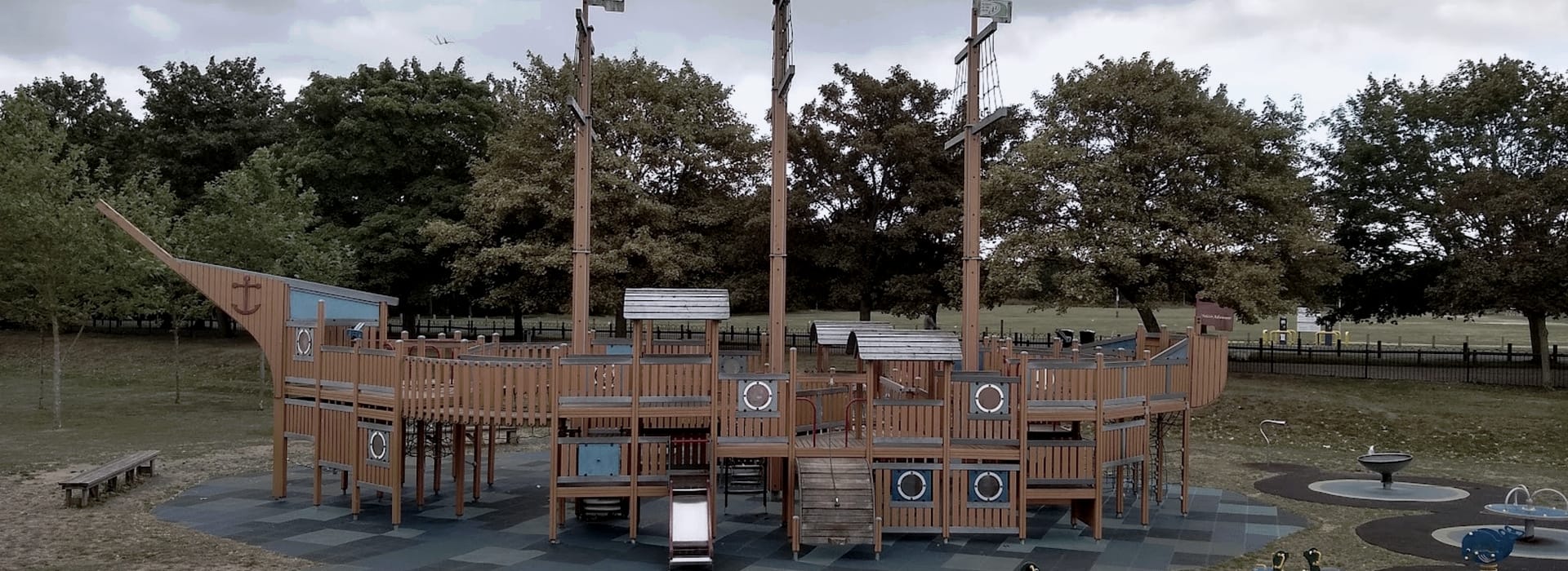 Bespoke Kitchens Maldon - Mastercraft Kitchens large wooden pirate ship playground with blue accents and three tall masts