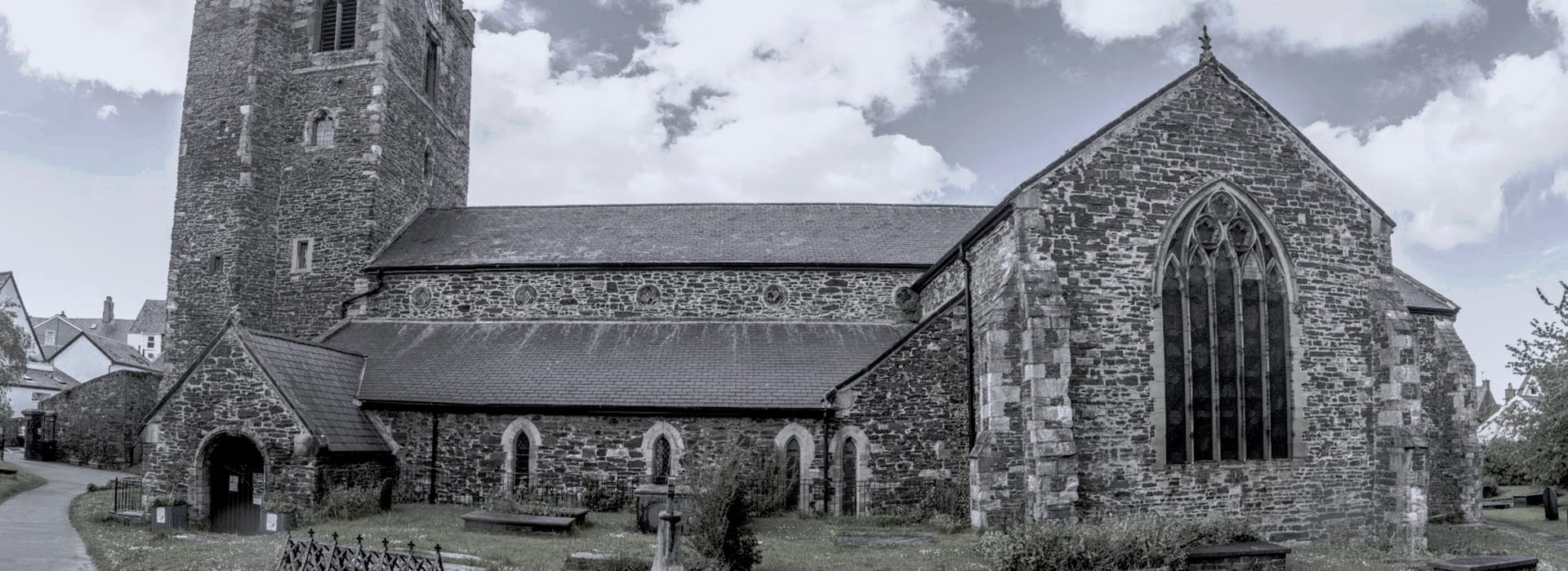Bespoke Kitchens Conwy - Mastercraft Kitchens stone church with tall square tower and large arched window