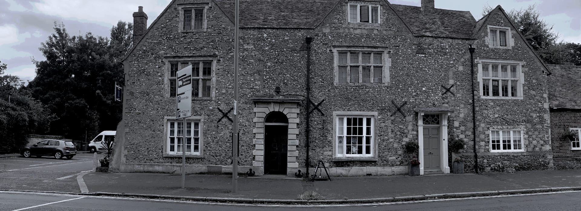 Bespoke Kitchens Wallingford - Mastercraft Kitchens historic stone building with large mullioned windows and grey tiled roof