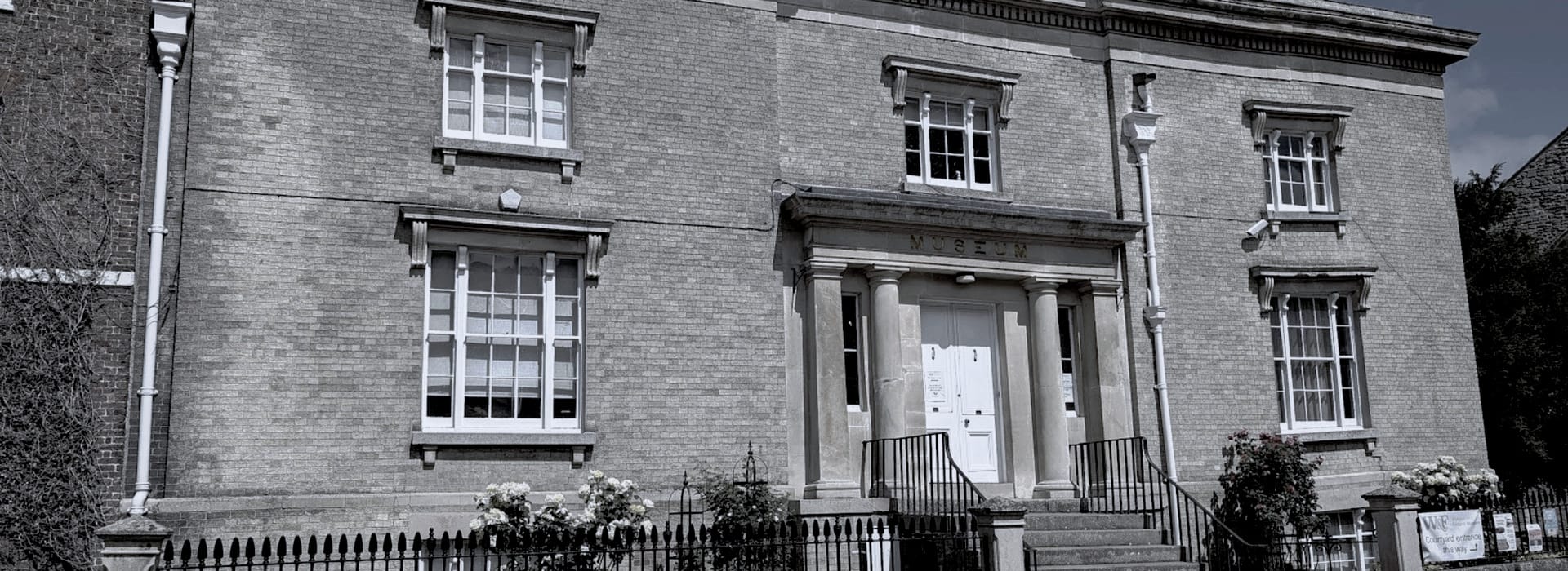 Bespoke Kitchens Wisbech - Mastercraft Kitchens Georgian-style brick museum with symmetrical windows and white columns at entrance