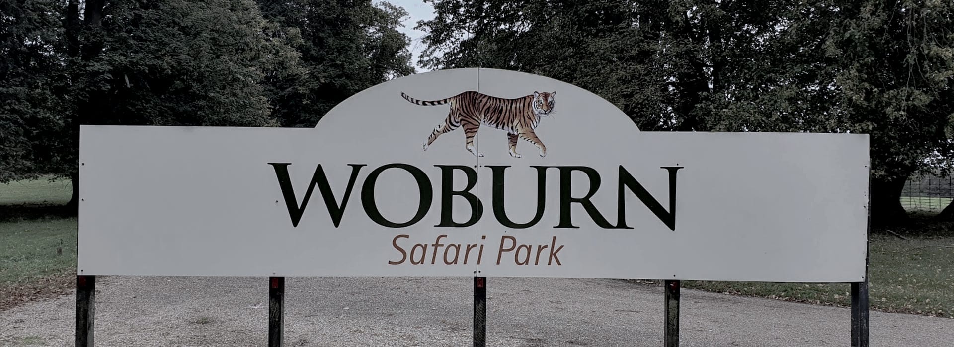 Bespoke Kitchens Woburn - Mastercraft Kitchens White sign with large black text and illustrated tiger above