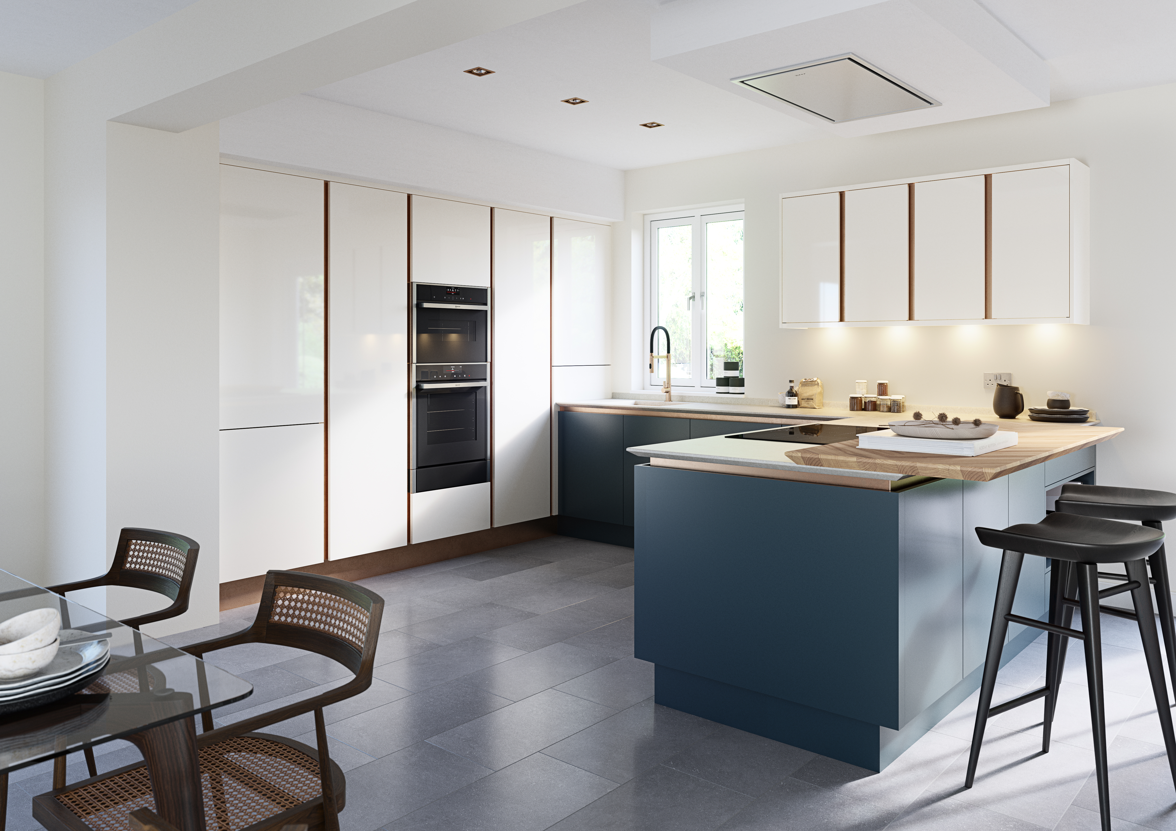 L-shaped kitchen with white gloss and blue handle-less units, an island with a wood breakfast bar, and grey flooring