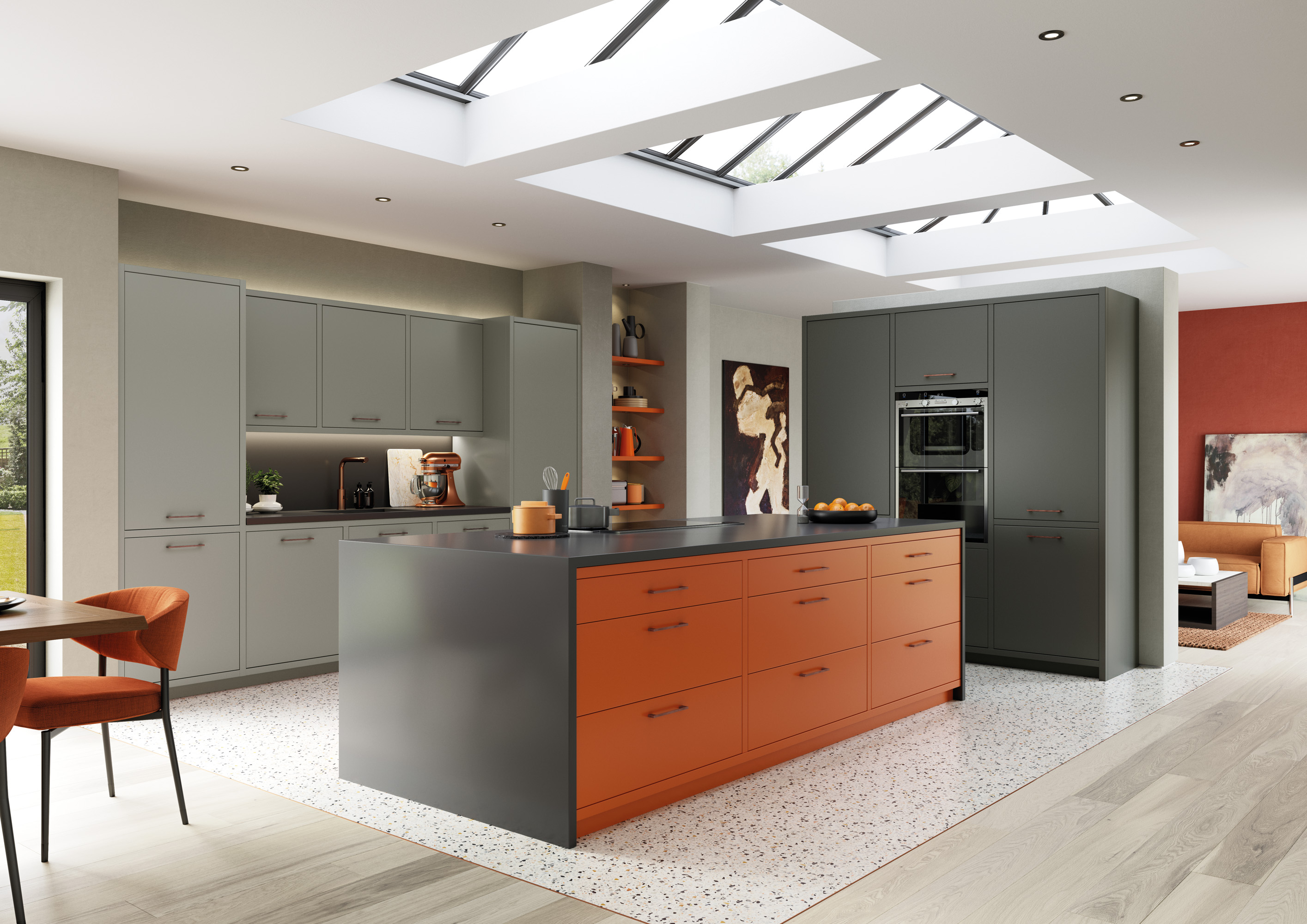 Open-plan kitchen with grey and orange slab cabinets, a large island, terrazzo flooring, and roof skylights